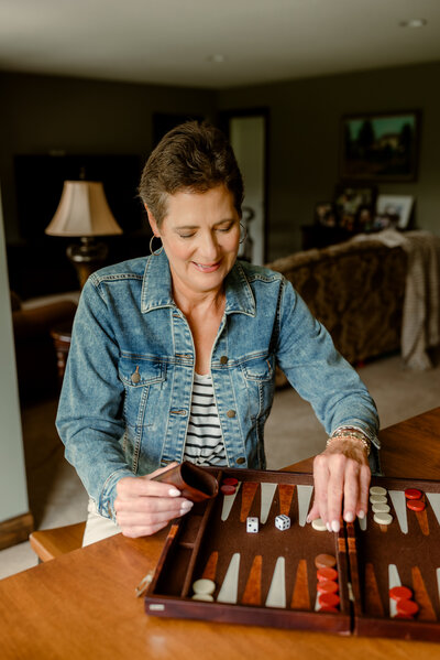 Carolyn enjoying her home space with a relaxed smile, photographed for her dating profile to highlight her true personality.