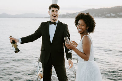 Couple celebrating elopement at Cannes on a sail boat