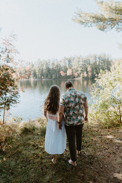 couple walking along lake