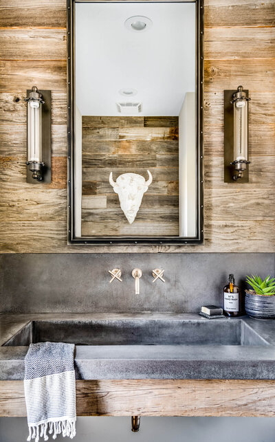 Rustic concrete sink with reclaimed wood in cabin