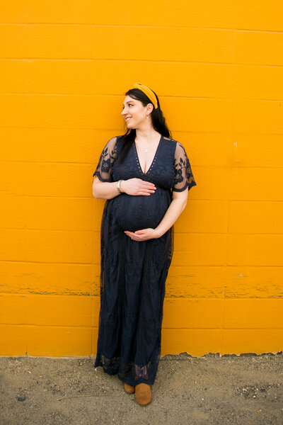Photo of Expecting Mother holding belly | Maine Photographer