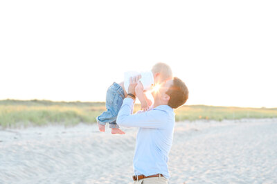 Girl running along boardwalk by Renee Kackley Photography