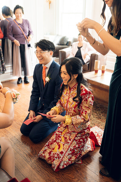 A bride and a groom standing next to each other showing off their shoes in Colorado. 