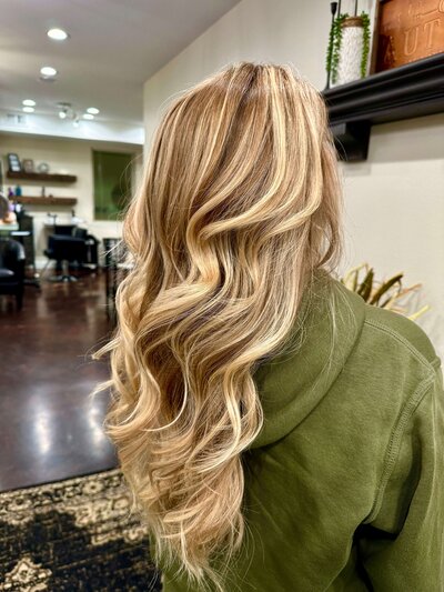 Blonde balayage with soft curls styled at Maven + Grace Salon in McMinnville, Oregon, highlighting expert coloring techniques