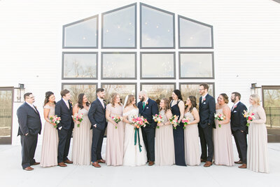 Photo of wedding party standing out on back outside patio at The Eloise