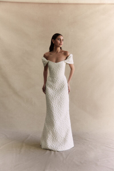 black and white image bride wearing  long sleeve lace wedding dress