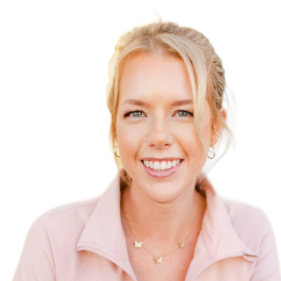 Blonde fair skinned woman smiling in pink top