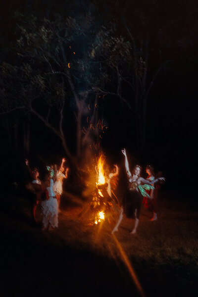 Couple in white kissing each other passionately.