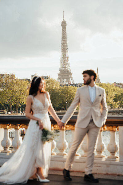 Couple eloping on Pont Alexandre III bridge Paris