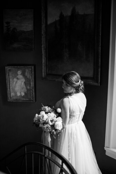 Bride descending a staircase at Greencrest Manor | Jeannine Lillie Events | Black and White Wedding Photography | Anna  Laero