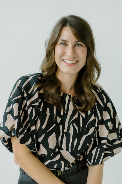 Woman smiling at the camera.