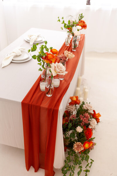 Wedding coordinator Shelsea Ray arranging floral details at a Central South Florida wedding.