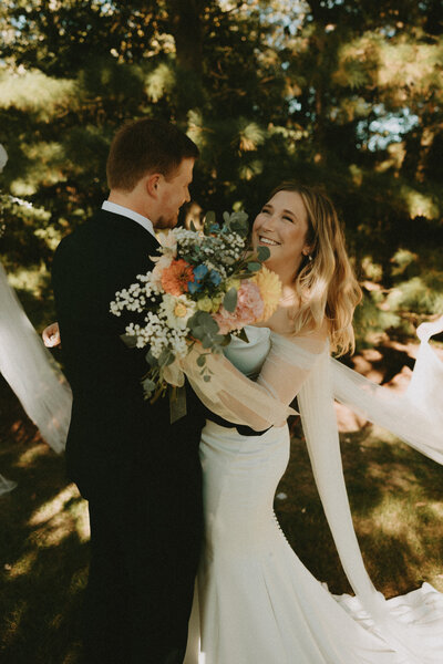 couple kissing intimately in a forest