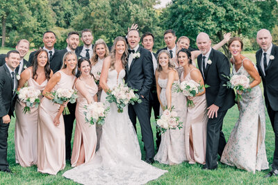 Wedding couple with their bridal party at Rosewood Farms, capturing a beautiful and timeless moment.