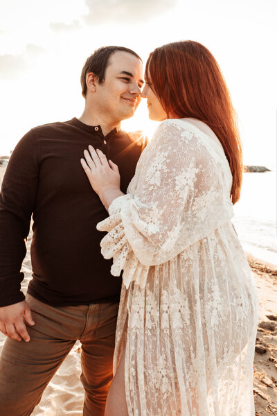 Photograph of Bethany Simms with her husband on a beach in Annapolis Maryland
