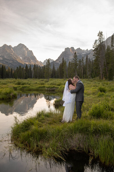 A couple share their first kiss during their Stanley Idaho elopement.