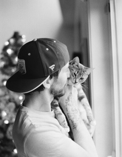 Seattle Wedding Photographer Joe Carvalho holding his cute cat 