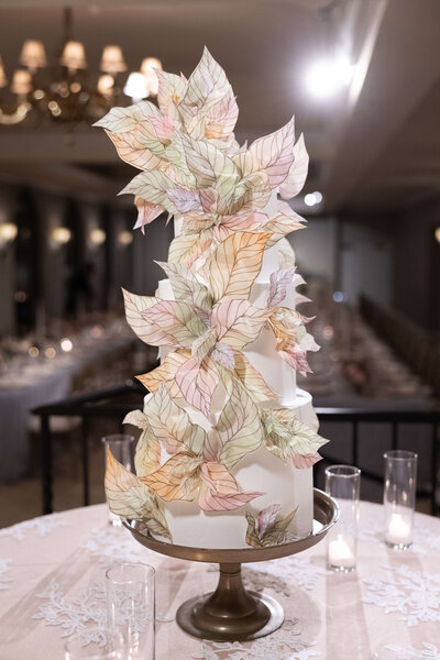 Detailed wedding cake with sugar leaves