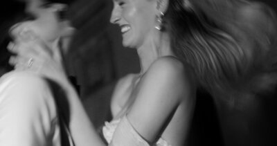 blurry black and white of bride and groom dancing