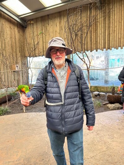Image of Nigel holding a parrot