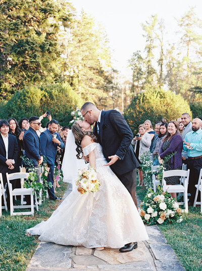 Bride and Groom portraits by a fountain in Maryland venue