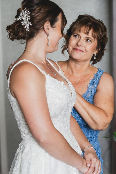 Bride and groom embrace during their wedding at the Ironwood in Lasalle, Illinois.