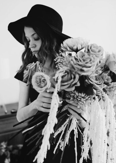 black and white image woman holding flowers