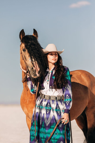 girl in prom dress with palomino horse