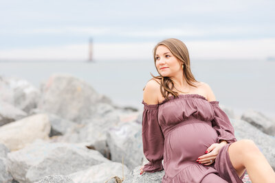 mom holding baby bump for maternity photos