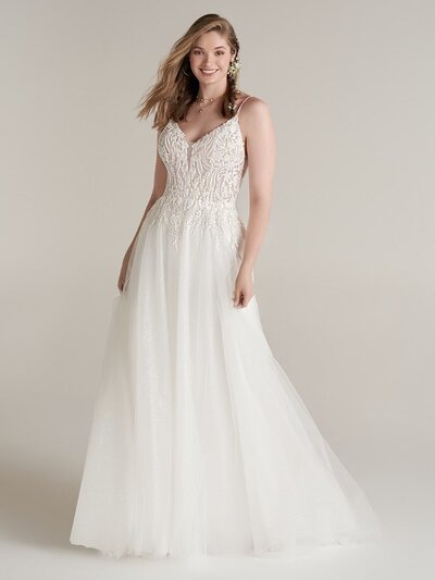 Fit-and-Flare Wedding Dress with Sleeves. Looking for a unique fit-and-flare wedding dress with sleeves? A ravishing neckline and romantic illusion make this an uncommonly sophisticated choice for your big day.