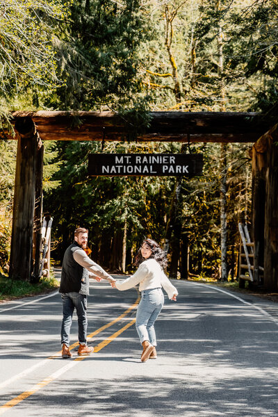Couple holding hands in Mt. Rainier National Park, PNW adventure session