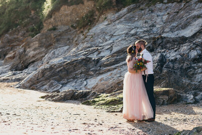 Bride wears pink dress for wedding in Cornwall