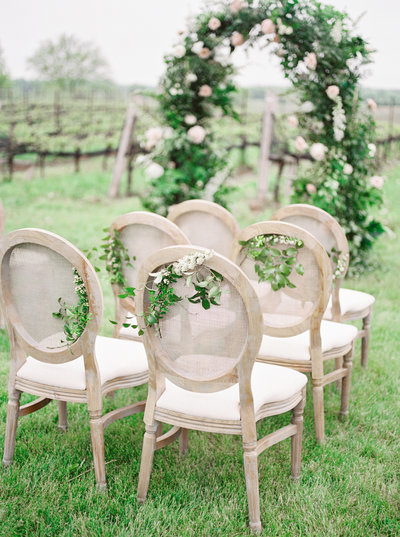 wedding venue chairs with flowers on them