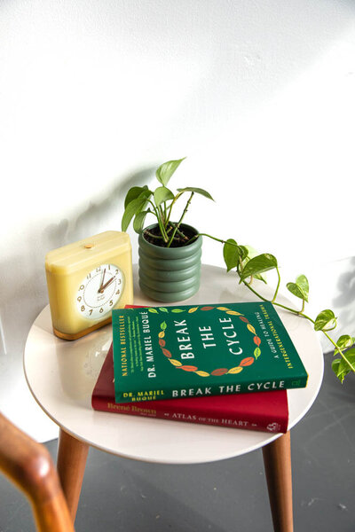 Lori Lubber's signature office clock and two of her favorite books
