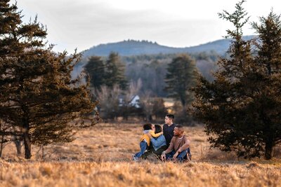 family of three girls with mom in a field in litchfield connecticut