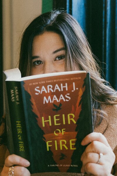 jennifer kahl poses with book for brand photos