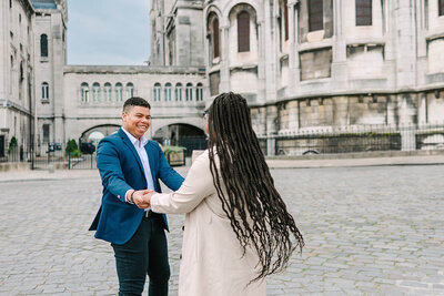 Couple dancing at Montmartre Square on Paris Proposal Photoshoot