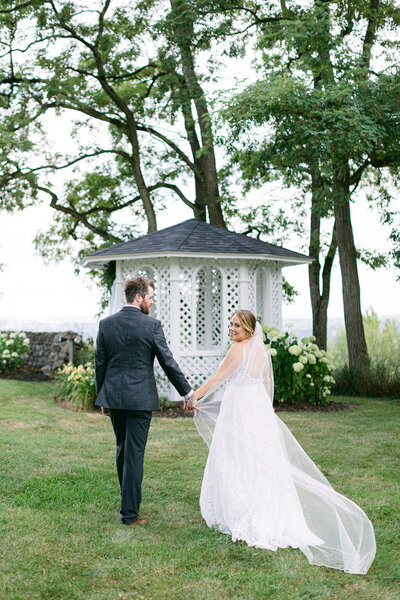 wedding portrait outdoors at windridge estate by the white restored gazebo