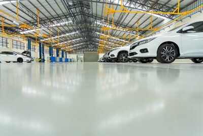 Commercial epoxy floor coatings by HERN Linemarking in South East Queensland, delivering long-lasting, high-gloss finishes for warehouses and showrooms in Brisbane, Gold Coast, and Sunshine Coast.