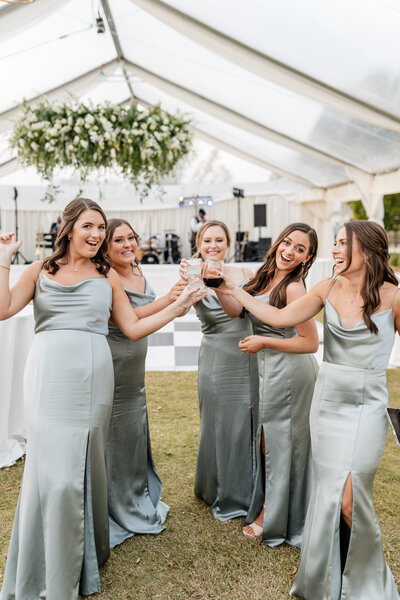 bridesmaids toasting glasses