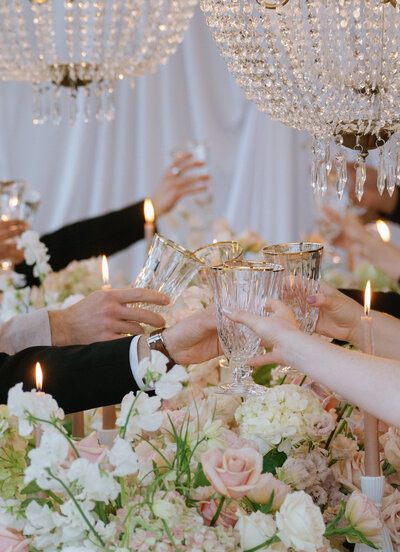 A group of guests make a toast with their champagne glasses at Venue3Two