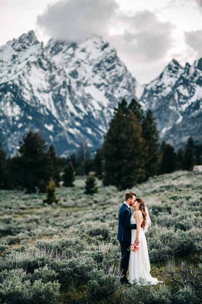 Bride and groom sharing a kiss during their elopement in Grand Teton National Park.
