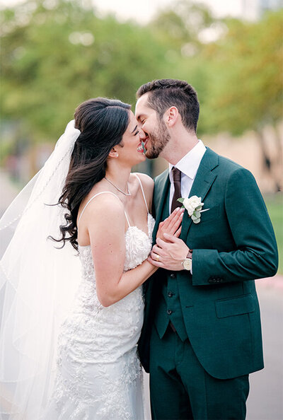 Couple portraits of bride and groom kissing at luxury Dallas wedding by White Orchid Phography