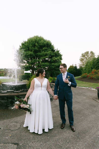 Bride and groom holding hands at Beaver Creek Ritz Carlton