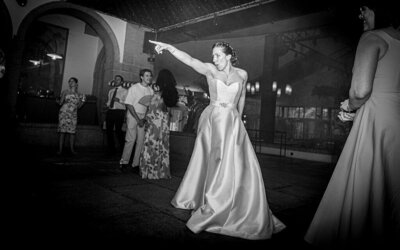 Bride pointing and dancing at Madrid wedding reception