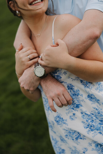 Kylie sitting on steps of college, for grad photos