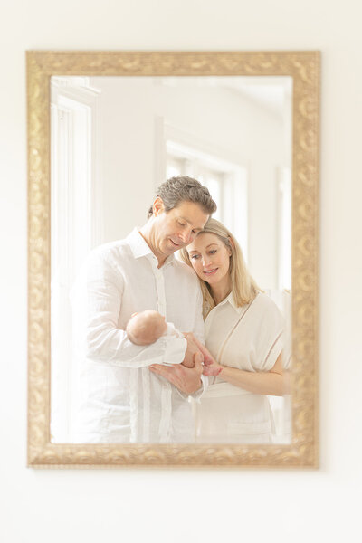 mirror-view of parents looking at the baby during Warrenton, VA newborn photo