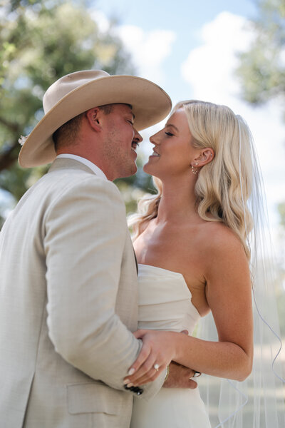 bride kisses her groom on the wedding day