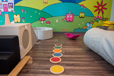 Colorful sensory activities and climbing toys for kids to play with during Hartbeeps classes.