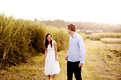 Man looking at her woman smiling behind him